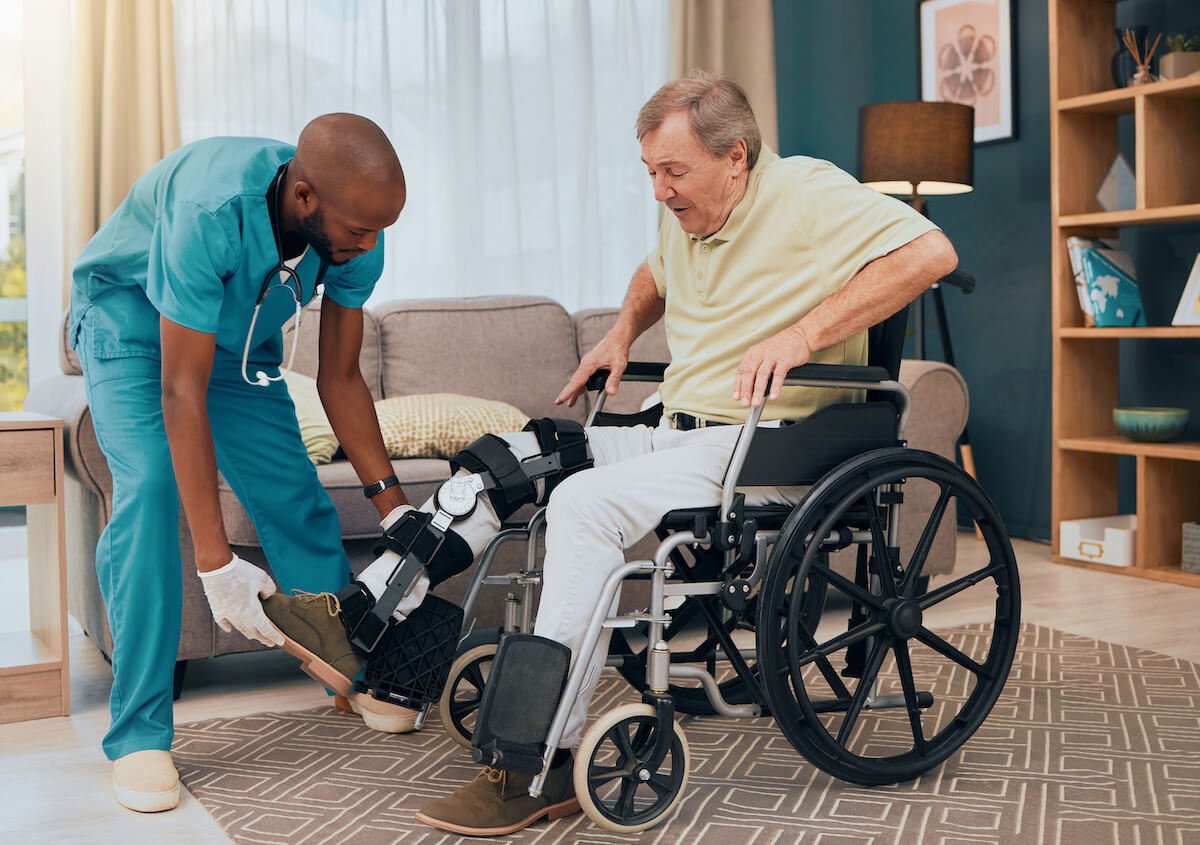 male therapist with patient in wheelchair (1)